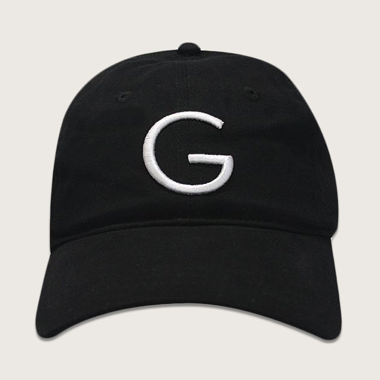 Guggenheim Black Baseball Cap with white embroidered “G” logo on front and curved brim