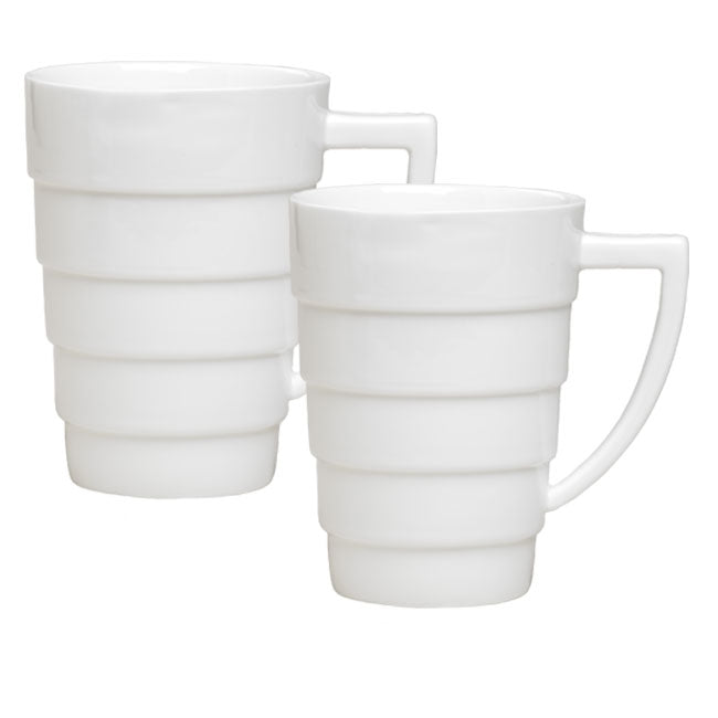 The Guggenheim Spiral Mug Set features two white mid-century modern porcelain mugs with horizontal ridges and large angular handles, stacked side by side against a plain white background.