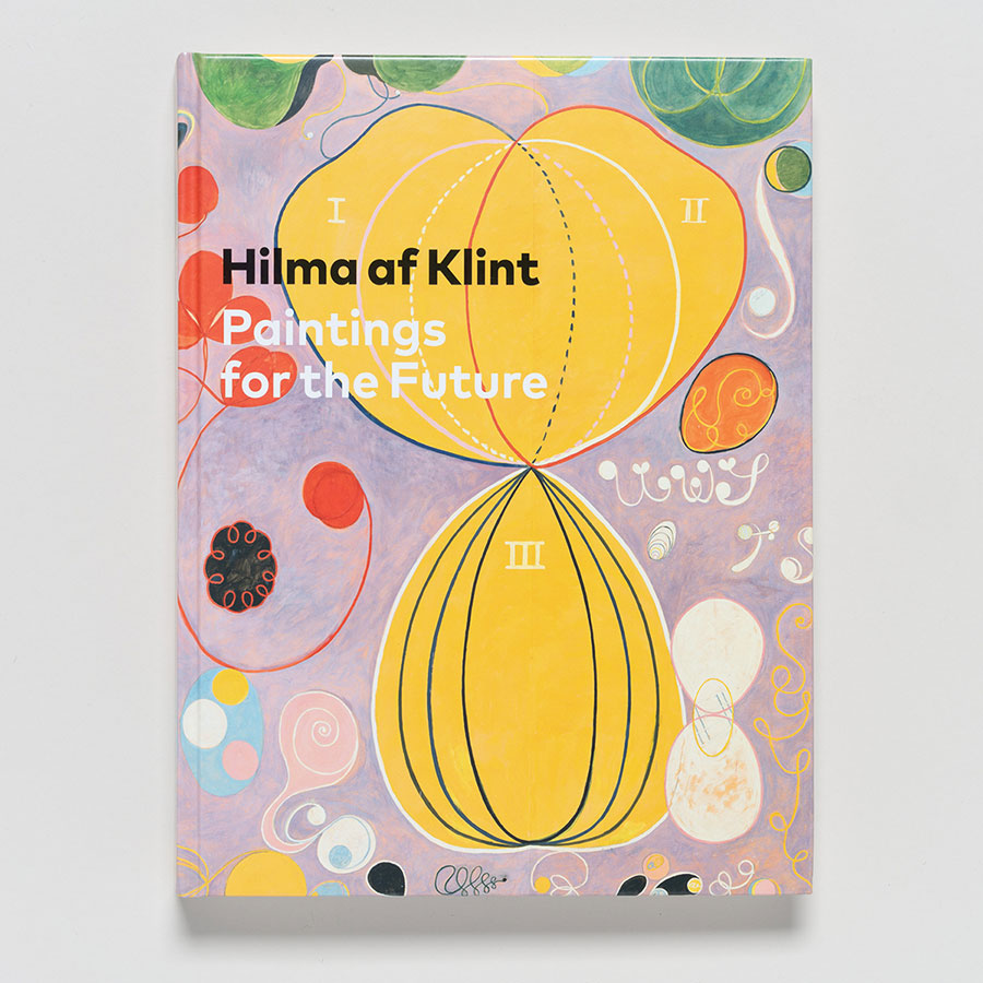 The book "Hilma af Klint: Paintings for the Future" features a vibrant cover with abstract shapes, two yellow ovals, swirling lines, and colorful circles on a pastel background, reflecting modernist abstraction.
