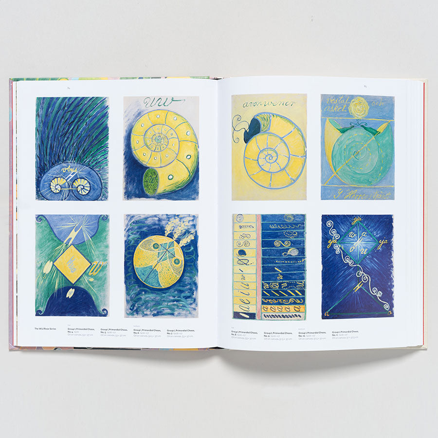 An open book, "Hilma af Klint: Paintings for the Future," displays colorful abstract illustrations in blue, yellow, and green grids. Inspired by modernist abstraction, the images feature spirals, geometric forms, and organic patterns.