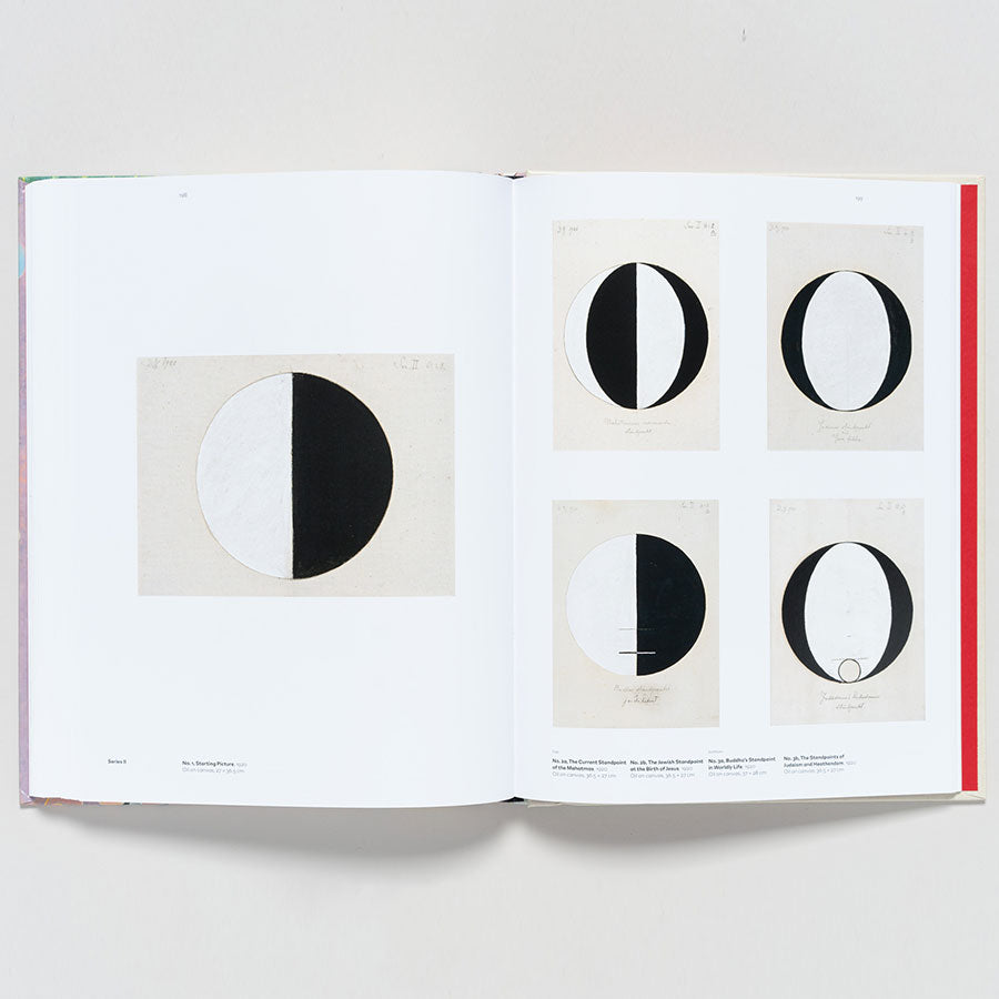 An open copy of "Hilma af Klint: Paintings for the Future" shows minimalist black-and-white geometric artworks—mostly circles split into halves. Four smaller images are on the right page, with a larger image displayed on the left.