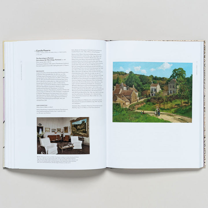 An open book, "Thannhauser Collection: French Modernism at the Guggenheim," shows text and two photos on the left—a furnished room and Thannhauser artwork. The right page features a vibrant modern painting of a village scene.