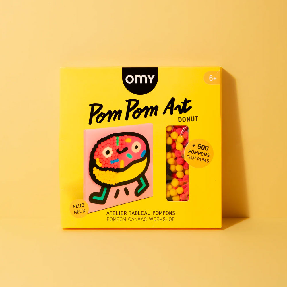 Guggenheim Museum Donut Pom Pom Art kit with self-adhesive canvas and colorful pom poms for fun donut crafting.
