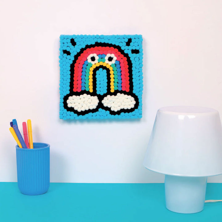 Rainbow Pom Pom Art by Guggenheim Museum—colorful pixel art with clouds, perfect for fine motor skill development.