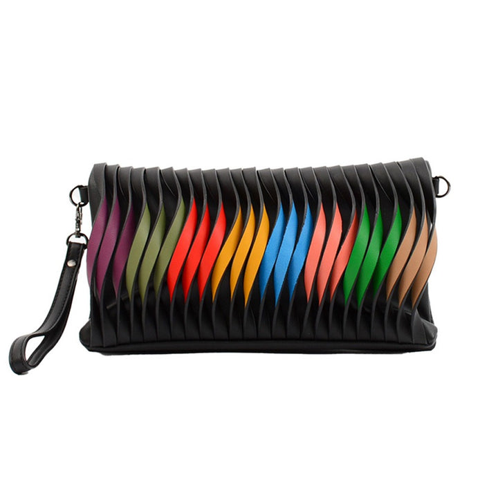 Guggenheim Museum Black Crossbody Rainbow Purse with slits showing vibrant stripes and a black wrist strap.