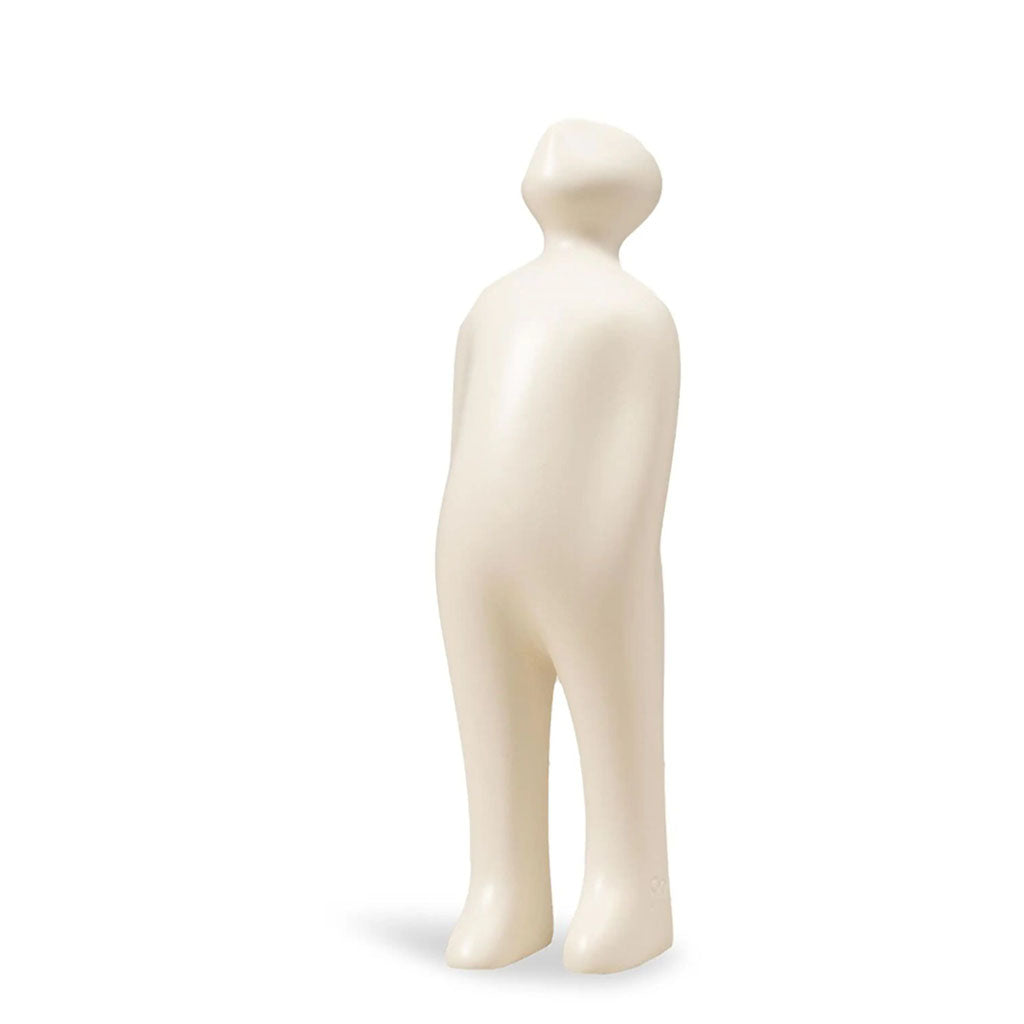The Visitor Sculpture, Small (White), is a smooth, minimalist cream-colored ceramic figurine with its head slightly tilted upward, reminiscent of Guido Deleu’s Belgian sculpture, shown against a plain white background.