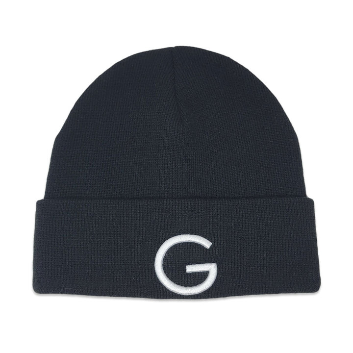 The Guggenheim Black Beanie features a folded brim and a bold white letter G embroidered on the front, adding standout style to your winter look.