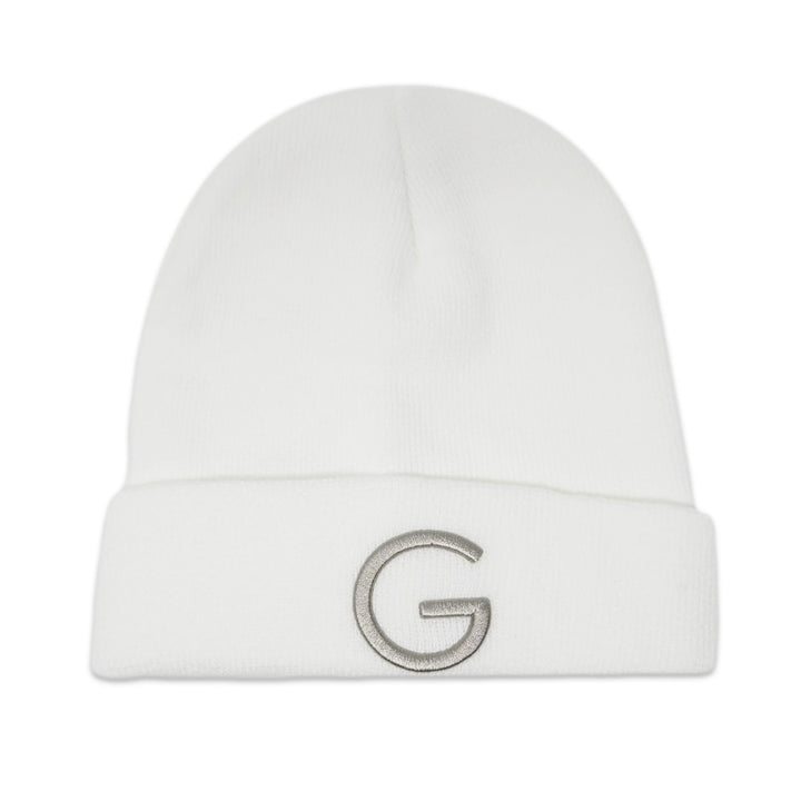 The Guggenheim White Beanie features a folded brim and a bold gray embroidered "G" on the front, making it a stylish winter accessory.