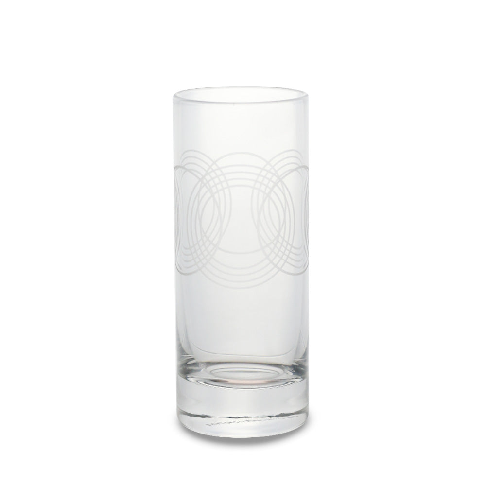 The Guggenheim Gates Cordial Glass, inspired by Frank Lloyd Wright, features a thick base and etched interlocking circles—ideal for cocktail lovers. Pictured against a plain white background.
