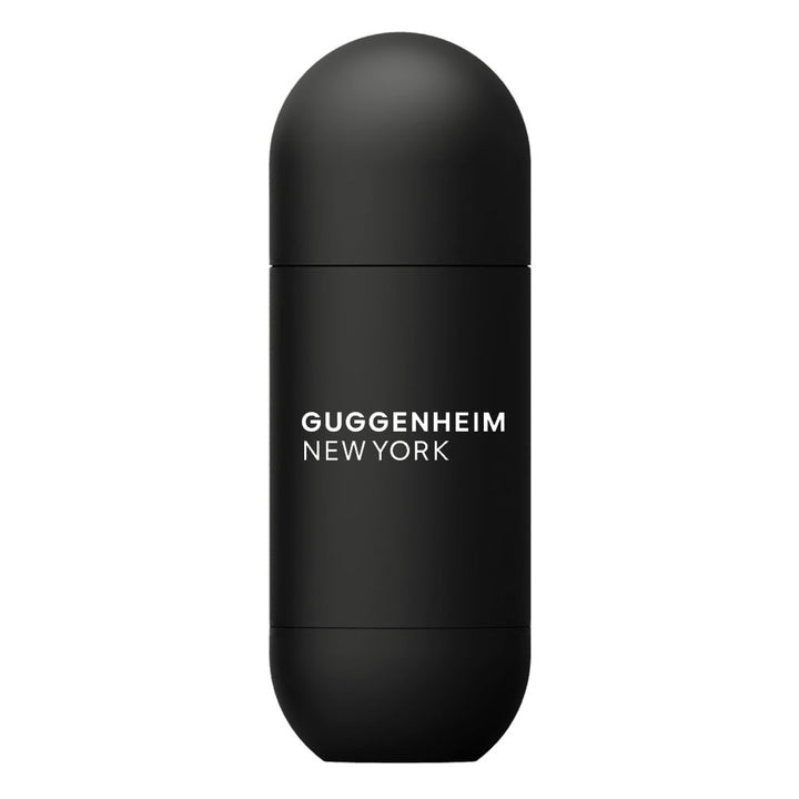 The Guggenheim Water Bottle is a sleek, matte black stainless steel bottle with rounded edges. "Guggenheim New York" is printed in white on the front. This modern, minimalistic travel bottle is leak-proof for everyday use.
