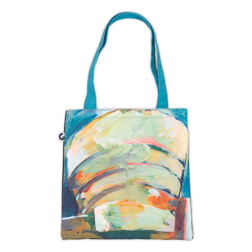 The Guggenheim Richard Hamilton Tote Bag is a stylish 16x13 cotton canvas tote with turquoise handles and an abstract, colorful painted design in green, yellow, orange, blue, and red.