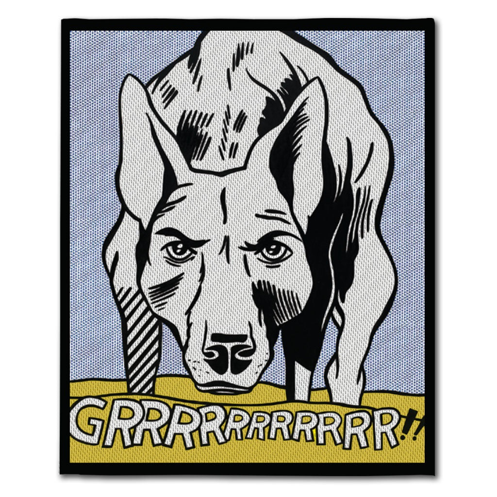 A stylized illustration of a growling dog in comic book style stands on yellow ground. The GRRRRRRRRRRR!! Wool Throw Blanket adds pop art flair, with “GRRRRRRRRRRR!!” boldly displayed at the bottom.