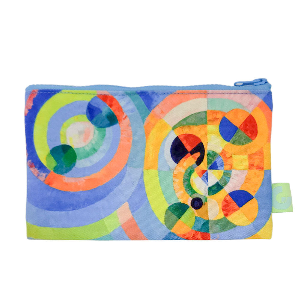 The Delaunay, Circular Forms Zip Pouch is a rectangular accessory with a zip closure, featuring an abstract geometric design of overlapping circles in blue, green, orange, yellow, and red— inspired by Robert Delaunay.