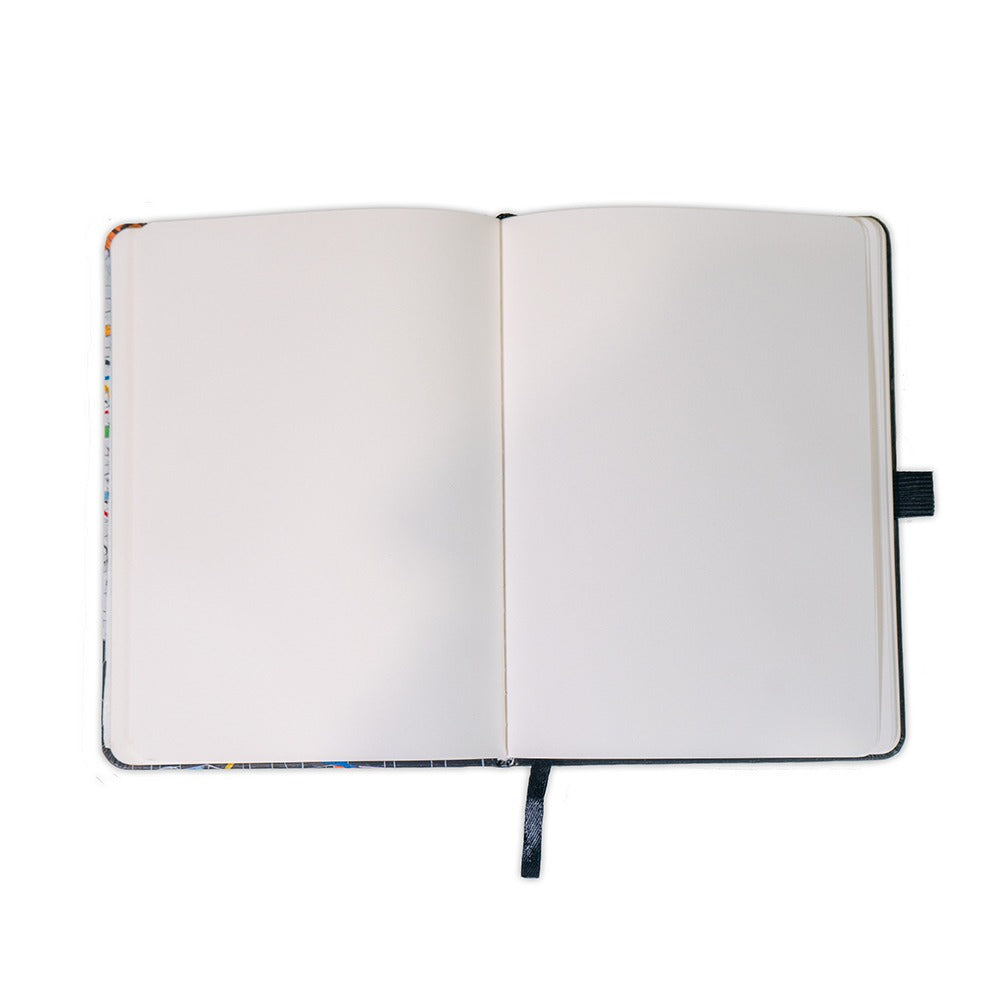 The Rashid Johnson Broken Man Vegan Leather Journal features blank white pages, a black cover, and a black ribbon bookmark—ideal for capturing thoughts inspired by Guggenheim exhibits or artist Rashid Johnson.