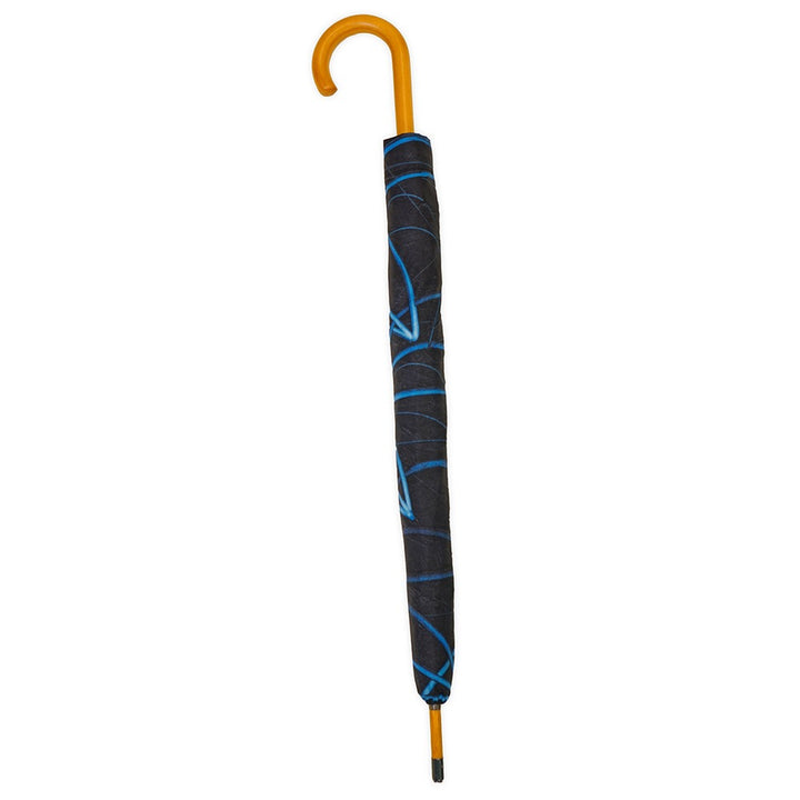 A closed Rashid Johnson Dual Sided Stick Umbrella, Untitled Seascape Drawing, with a curved wooden handle and black cover featuring a blue abstract pattern, is shown against a white background.
