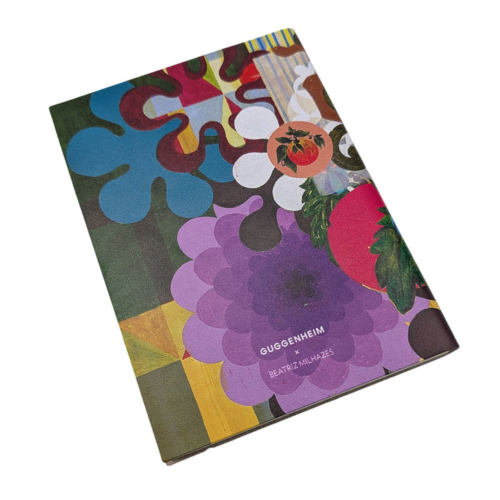 A colorful abstract cover with flower and fruit motifs, styled like the Guggenheim Beatriz Milhazes Leather Journal. Title and author are printed on the front, with the book shown against a white background.