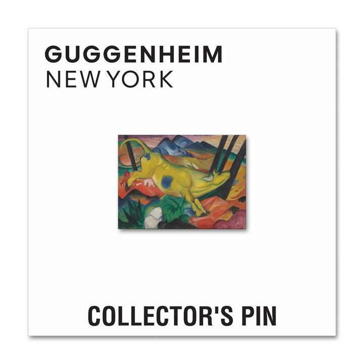 The Franz Marc Yellow Cow Pin is a nickel-plated collector’s pin (1.22" W x 0.92" H) featuring the colorful artwork, mounted on a white card labeled “Guggenheim New York” on top and “Collector’s Pin” at the bottom.