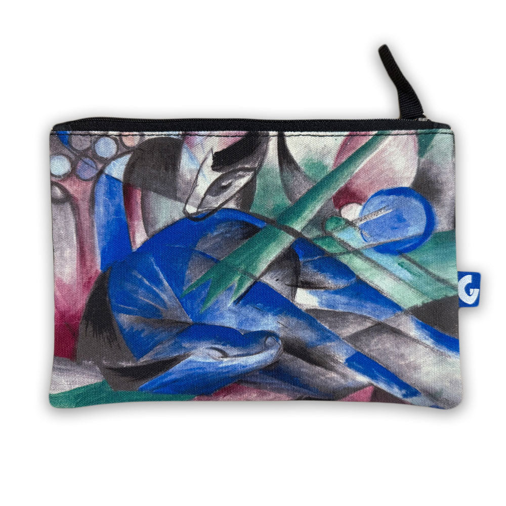 The Franz Marc Dreaming Horse Pouch is a small zippered pouch featuring abstract blue, green, black, and white art of stylized animals and geometric shapes. It has a black zipper and a small blue side tag.