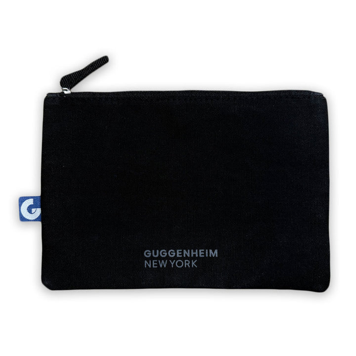 The Franz Marc Dreaming Horse Pouch is a black zippered pouch with a small blue tag on the left and "GUGGENHEIM NEW YORK" printed in white near the bottom center, combining style with German Expressionist flair.