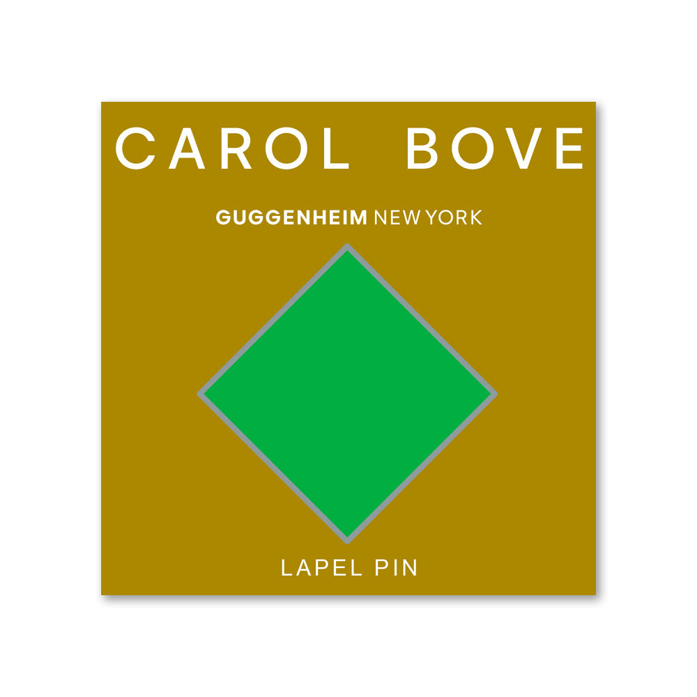 Lapel pin packaging with a green diamond design on a gold background, featuring 'Carol Bove' and 'Guggenheim New York'.