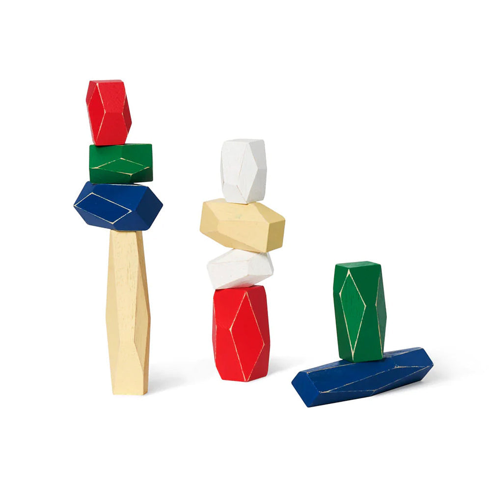 Three stacks of Balancing Blocks in red, green, blue, white, and beige are shown balanced atop each other against a white background.