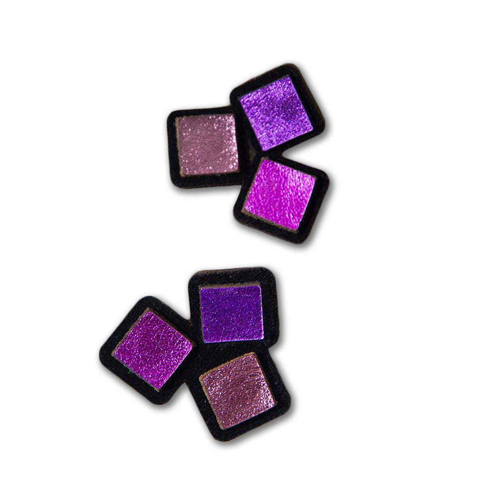 Four square makeup eyeshadow pans in deep purple, lavender, and magenta shimmer are arranged diagonally on a white background, reflecting the vibrant hues of Purple Square Earrings.