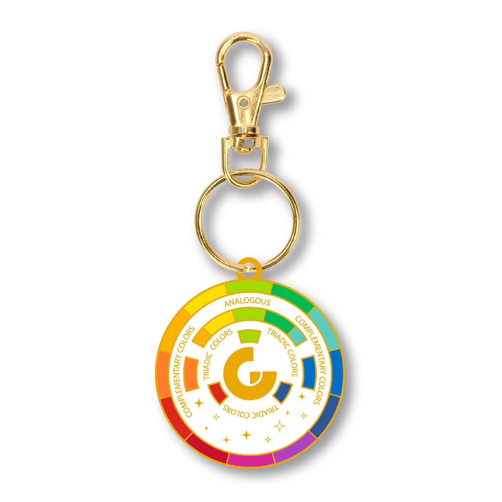 The Guggenheim Museum Color Wheel Keychain displays color theory terms—a stylish art accessory by Guggenheim Museum.
