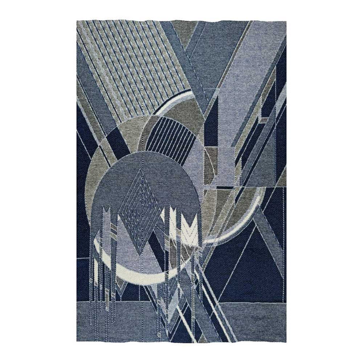 The Guggenheim Frank Lloyd Wright Frozen Spheres Wool Throw adds modern geometric style to any space.