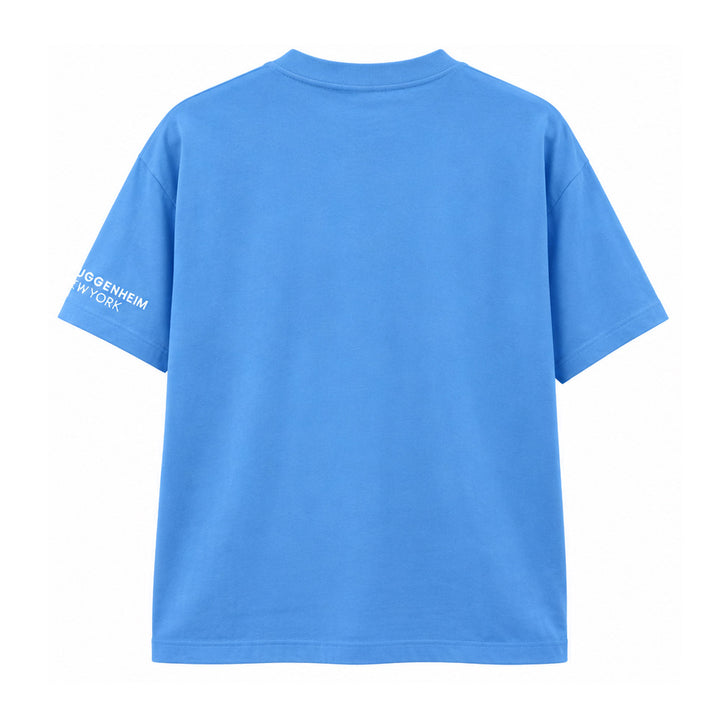Back view of a bright blue Guggenheim Museum Taryn Simon T-Shirt with white text on the right sleeve.