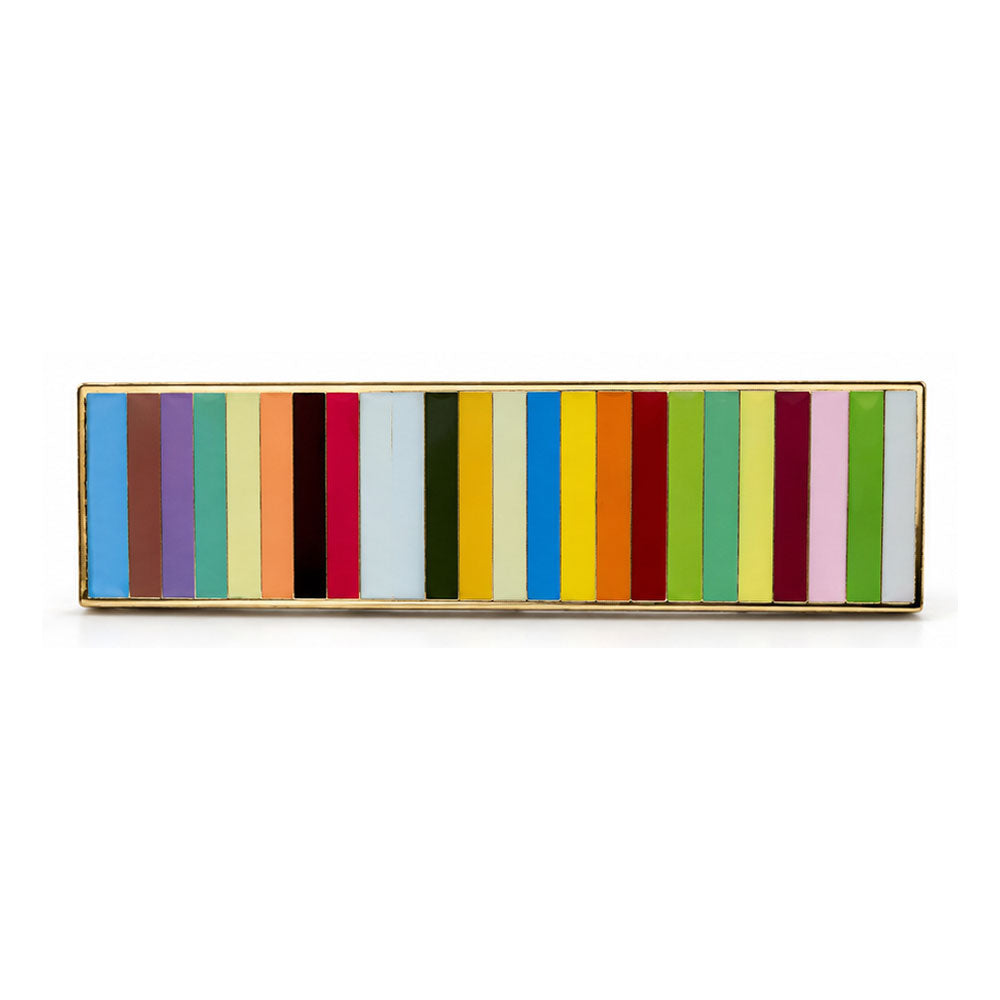 Guggenheim Museum Taryn Simon Striped Pin, a rectangular gold-toned pin featuring a row of multicolored enamel stripes.