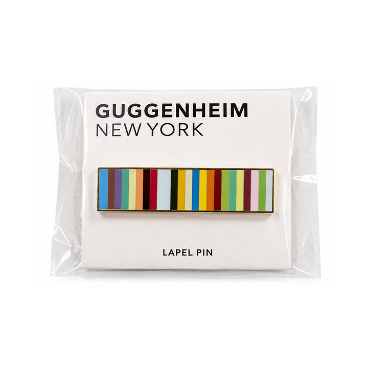 Guggenheim Museum Taryn Simon Striped Pin, a rectangular multicolored striped pin in a clear sleeve on a museum card.