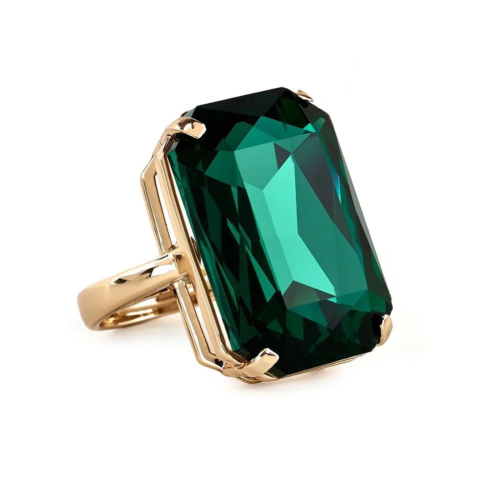 Guggenheim Museum Emerald Rectangle Statement Ring: gold-tone band with large emerald-cut green stone in prong setting.