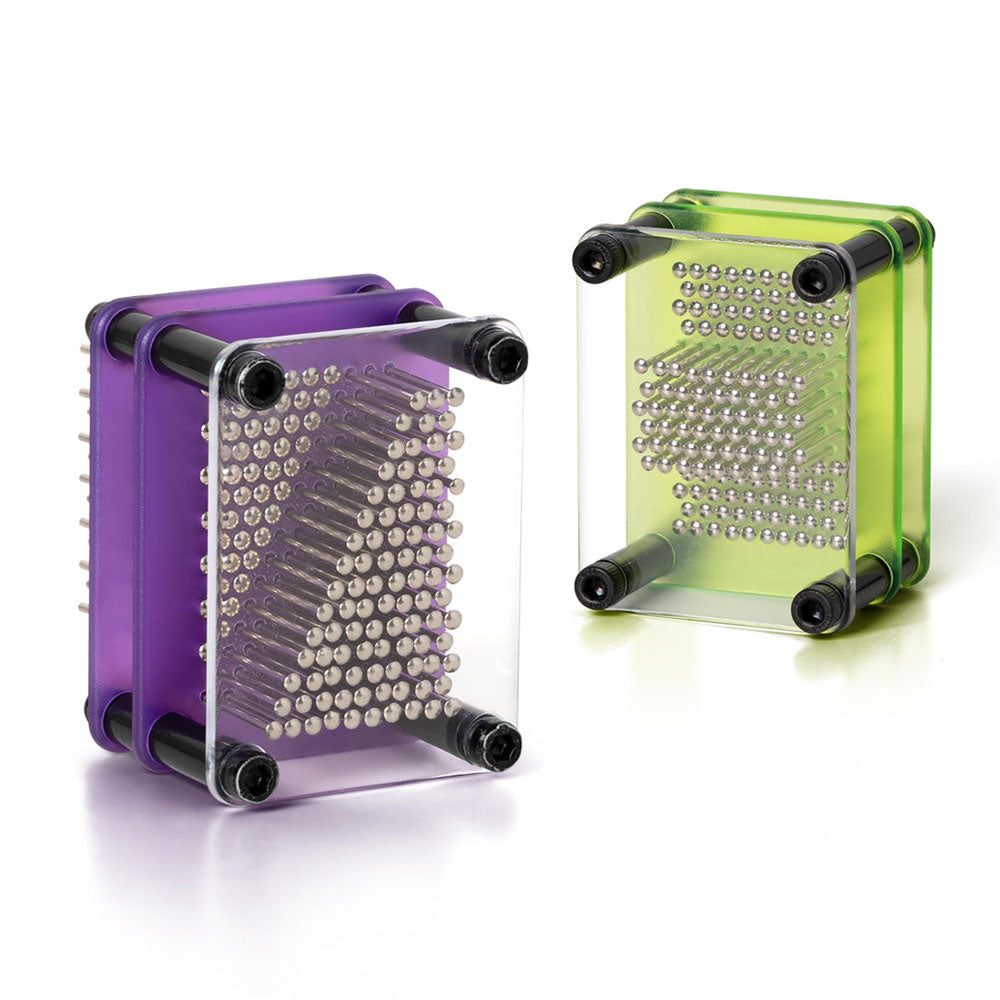 Two Guggenheim Museum Micro Pin Art toys, purple and green, form tactile imprints inside clear frames.