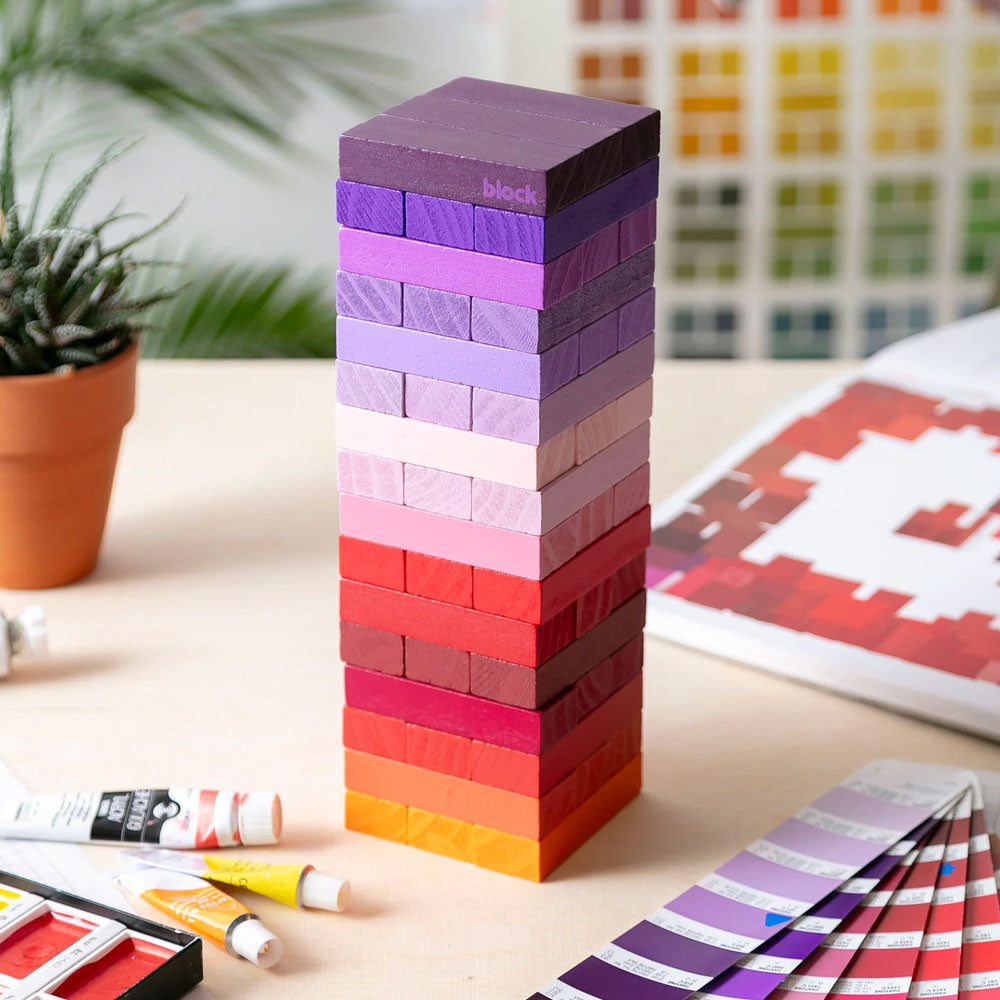 The Guggenheim Museum’s Warm Gradient Tower is a vibrant wooden game arranged by shade among art supplies.