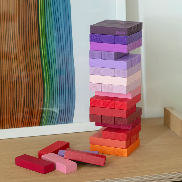 The Guggenheim Museum Warm Gradient Tower stands near rainbow art—ideal as playful decor or a fun wood learning game.