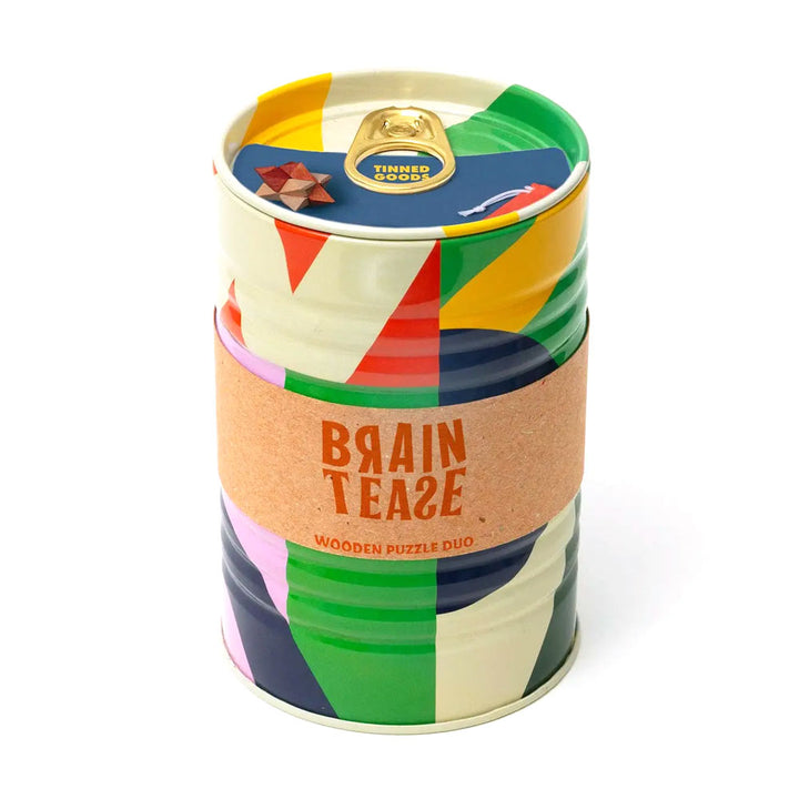 The Guggenheim Museum Tinned Goods Brain Tease Puzzle Duo features abstract patterns and a brown band for educational fun.