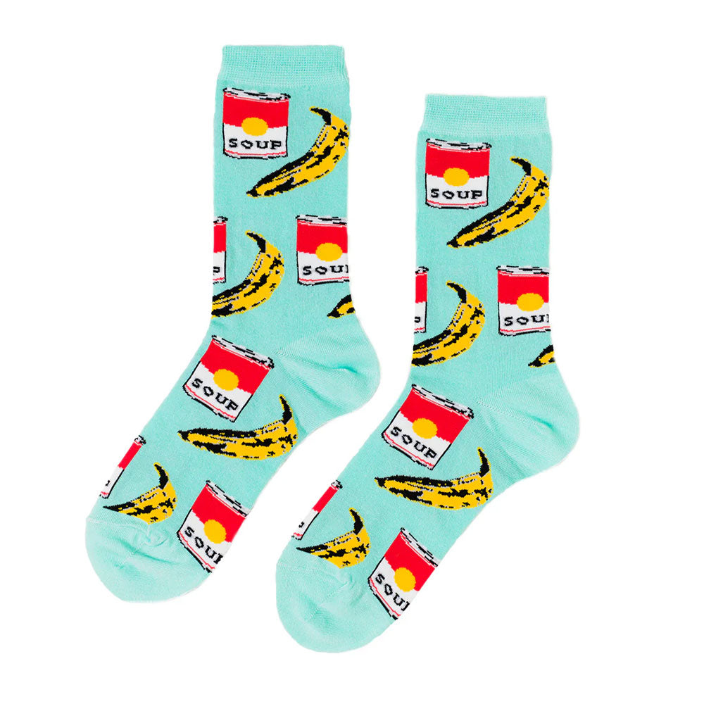 Turquoise Pop Art Socks by Guggenheim Museum feature yellow bananas and Campbell’s soup cans for an artistic vibe.