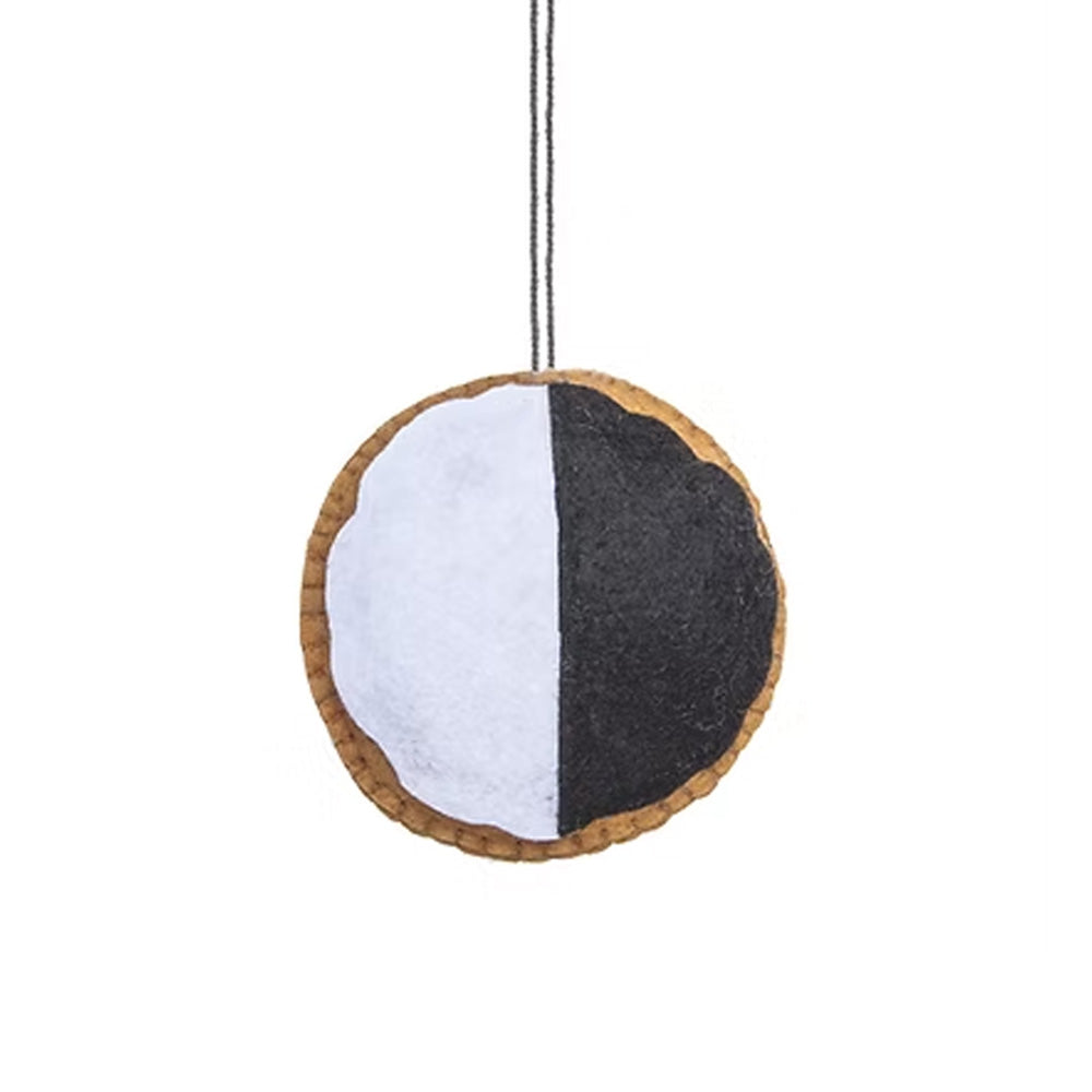 The Guggenheim’s Black & White Cookie Ornament is a round felt piece handmade and strung by Kyrgyz artisans.