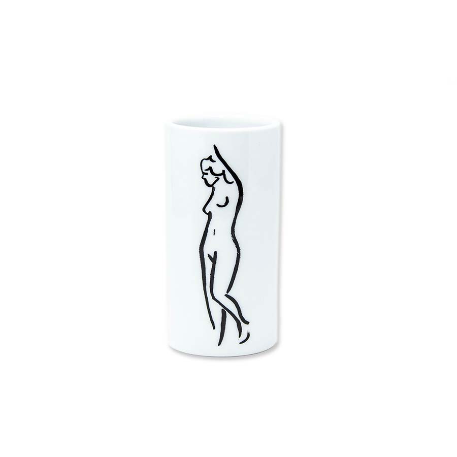 The Nature's Table Standing Nude Bud Vase is a white porcelain vase, microwave and dishwasher safe, featuring a minimalist black line drawing of a nude figure with one arm raised on a plain white background.
