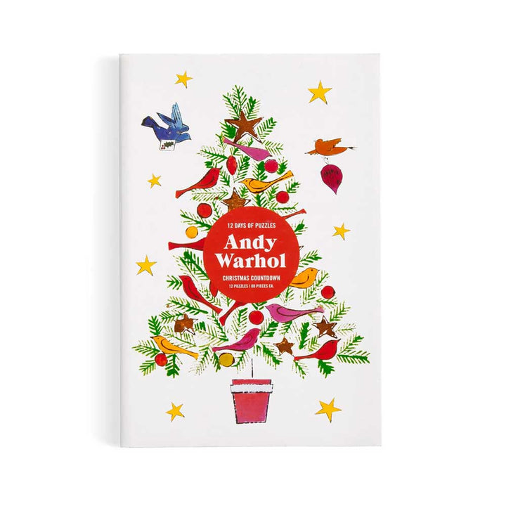 Book cover: Christmas tree, red birds, stars, and Guggenheim Andy Warhol 12 Days of Puzzles Countdown in the center.