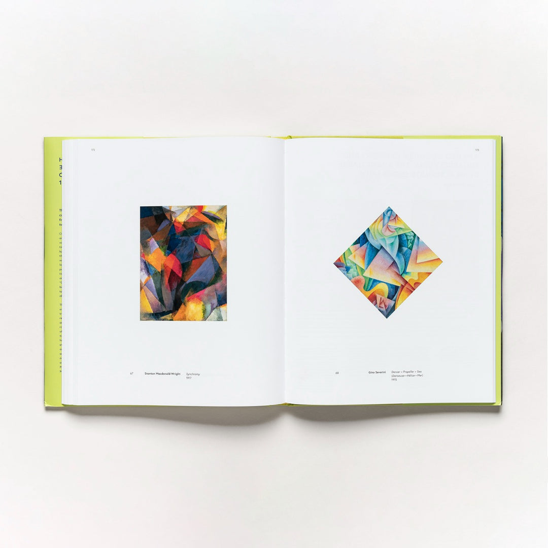 An open copy of Harmony and Dissonance: Orphism in Paris, 1910–1930 shows two abstract Orphist paintings—one rectangular on the left page, one diamond-shaped on the right—featuring vibrant, overlapping shapes and colors.