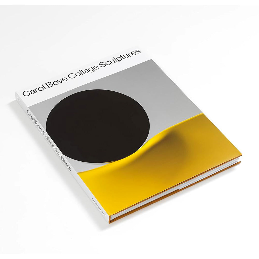 The book "Carol Bove: Collage Sculptures" rests on a white surface, featuring the contemporary artist's work with a cover design of a large black circle and a curved yellow shape over a gray and white background.