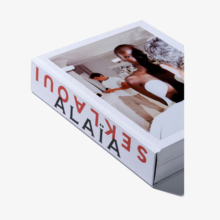 A limited-edition Alaïa by Seklaoui book featuring a striking image of a man and woman, with creative direction from Pieter Mulier.