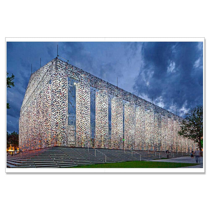 Marta Minujín: Arte! Arte! Arte! by Guggenheim Museum shines as a beacon of Latin American avant-garde art at dusk.