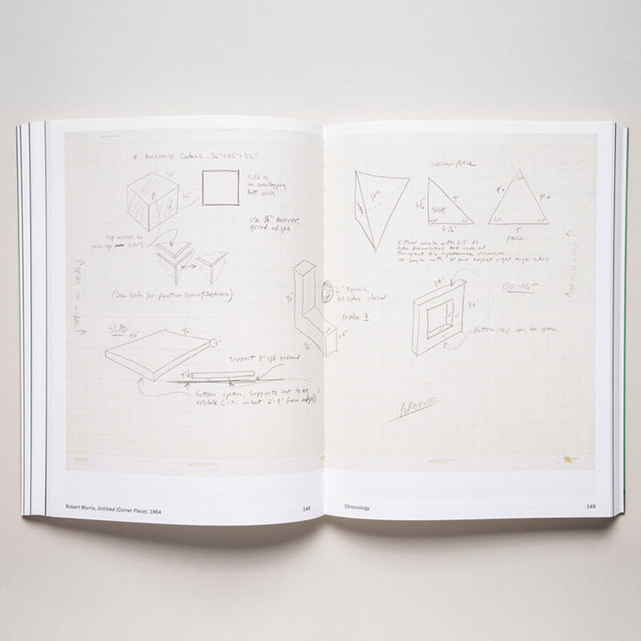 An open copy of "Object Lessons: Case Studies in Minimal Art-The Guggenheim Panza Collection Initiative" lies open, featuring hand-drawn geometric sketches and notes on graph paper that highlight minimalism and conceptual art influences.