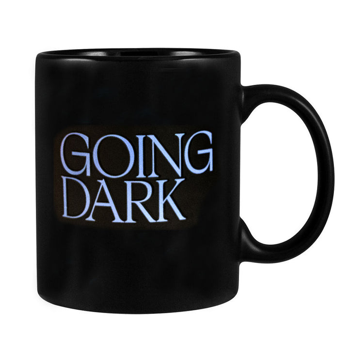 The Going Dark Color Changing Mug is a black stoneware mug featuring "GOING DARK" in bold white letters—a striking, contemporary statement for any space.