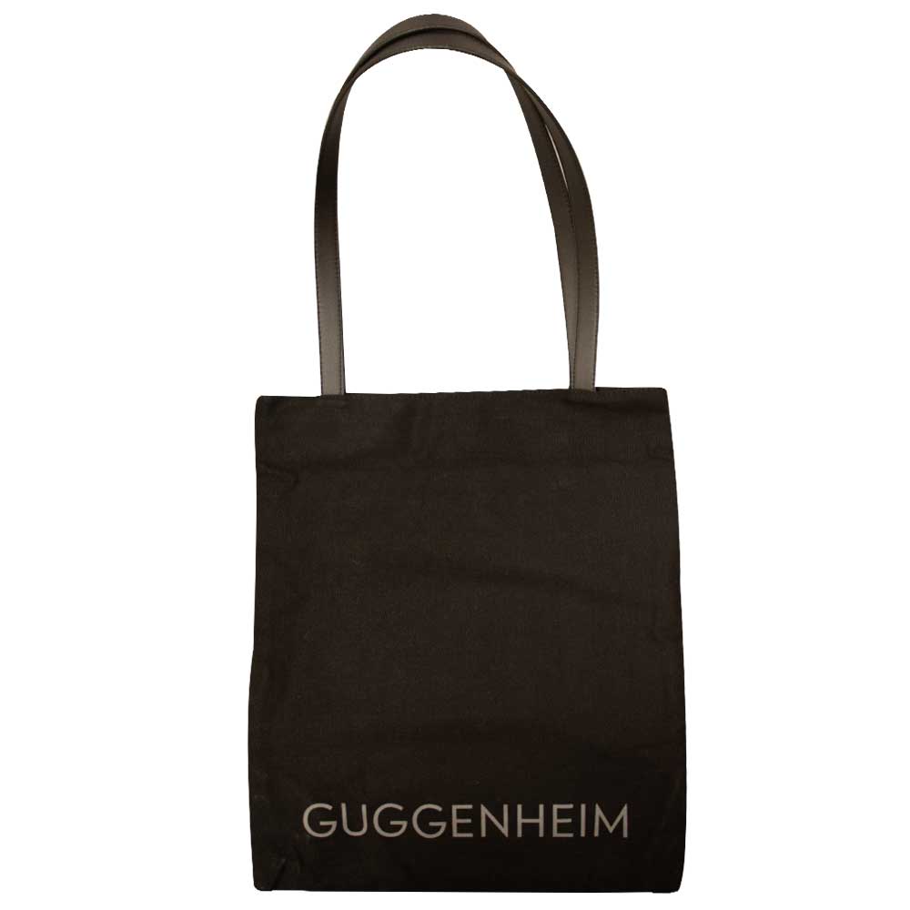 The Guggenheim "Go Dark" Tote is a limited edition black bag with two handles and "GUGGENHEIM" printed in light letters at the bottom—ideal for contemporary art fans.