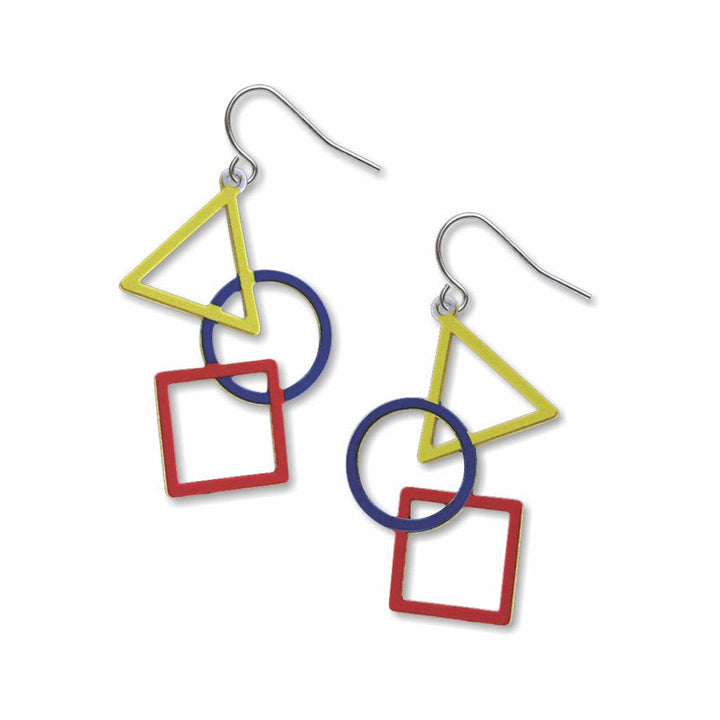 The Kandinsky Earrings feature a yellow triangle, blue circle, and red square linked together, hanging from a silver hook. Bold Bauhaus-inspired geometric shapes create modern style with primary colors—perfect statement earrings.
