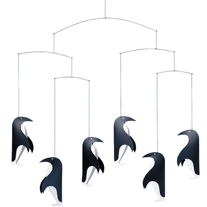 The Penguin Talk Mobile by Flensted features six black-and-white stylized penguins, each suspended at different heights on thin strings. This minimalist mobile adds whimsical decor, with penguins facing various directions.