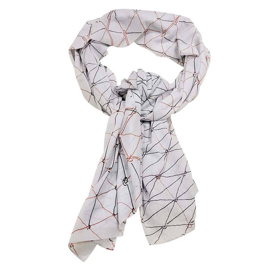 A light gray Gego Scarf, Cotton Oblong, features intersecting red and black lines forming geometric shapes inspired by the Measuring Infinity exhibition at the Guggenheim Museum, shown here loosely knotted.